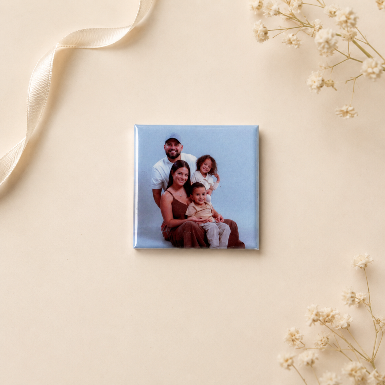 Single family photo magnet on soft neutral flatlay