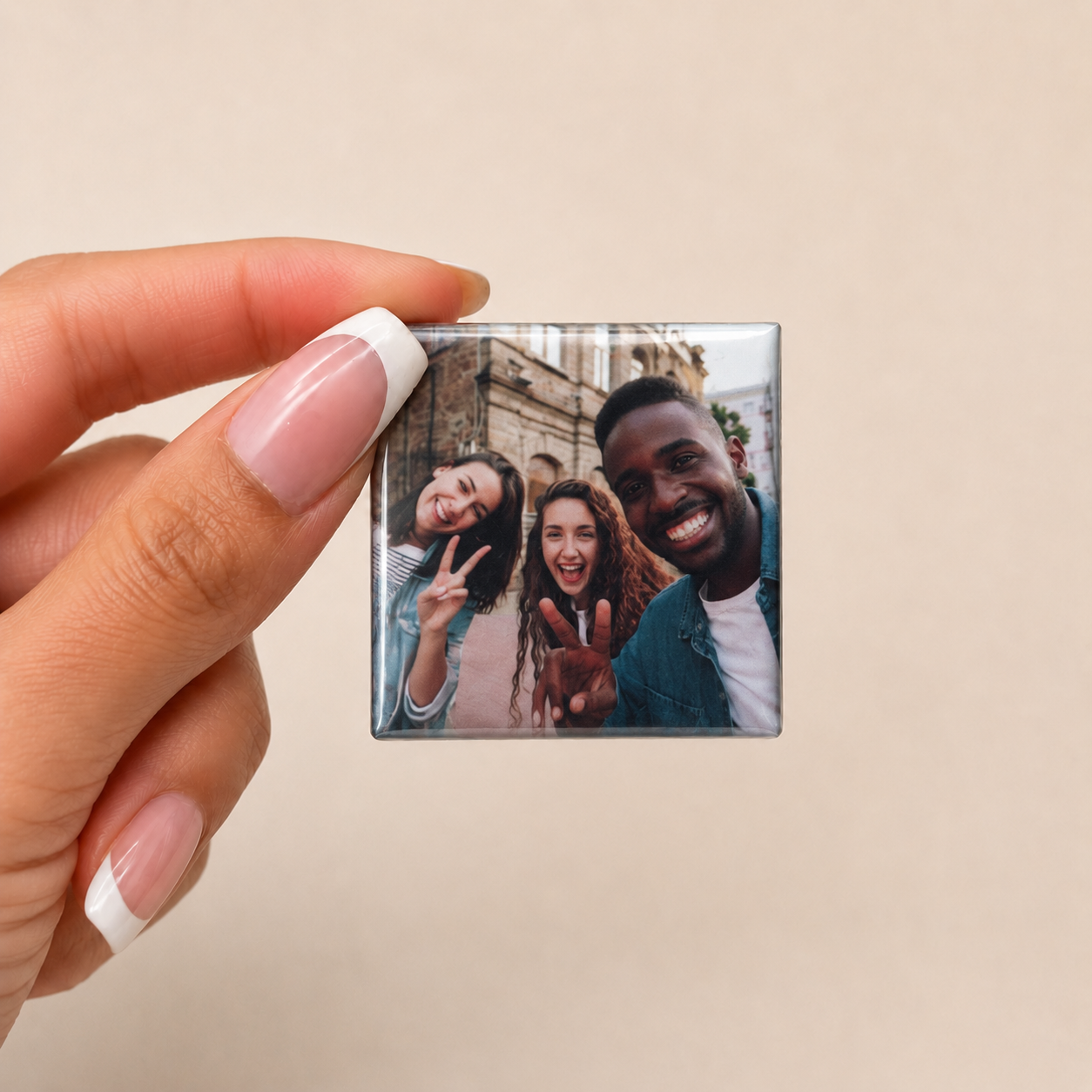 Single square custom photo magnet held in hand